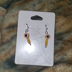 Yellow evil eye earrings